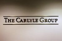 Un cartel del fondo de inversión Carlyle Un cartel del fondo de inversión Carlyle